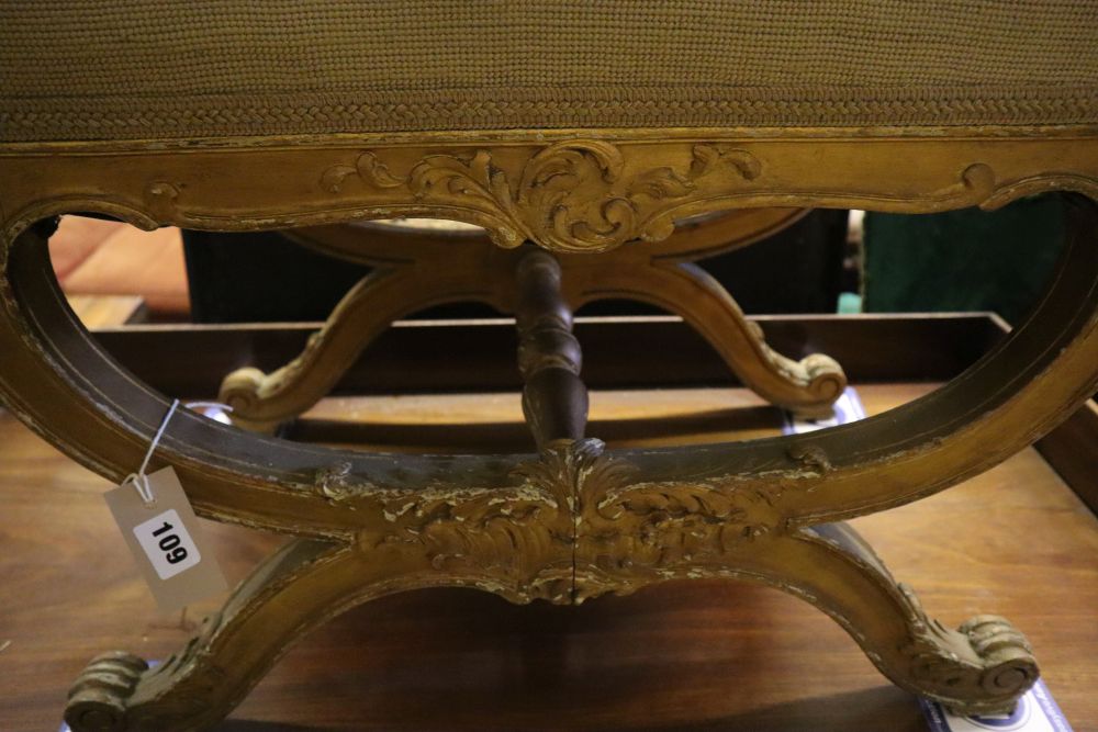 A 19th century giltwood X frame dressing stool, width 60cm, depth 40cm, height 46cm